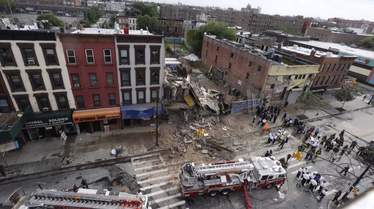 Firefighters at the scene of a building collapse in Brooklyn on Fulton ave on July 14, 2015.