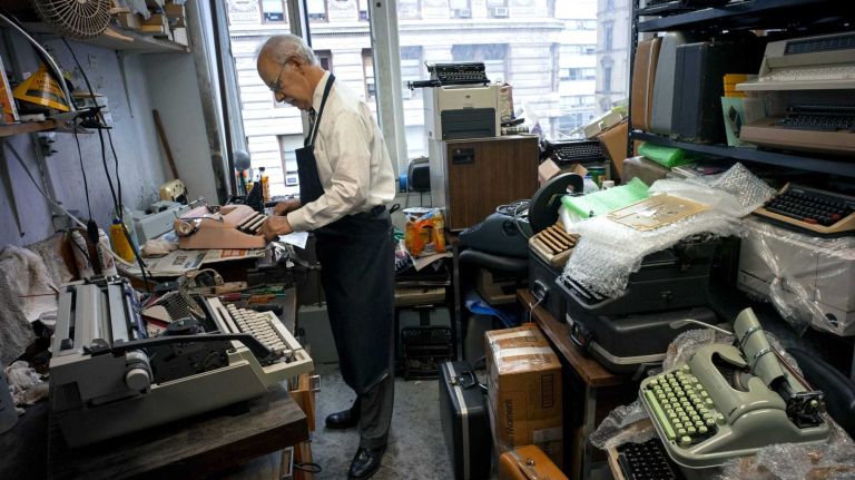 Paul Schweitzer works in the repair shop of the Gramercy Office Equipment Co. in Manhattan on Thursday, July 2, 2015. The company specializes in fixing vintage typewriters and also going to people's homes to fix their old typewriters and HP printers.