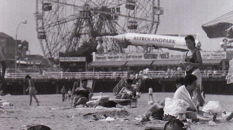 Two youngsters build castles in the sand at Coney Island on a hot and hazy beach day on July 11, 1987.