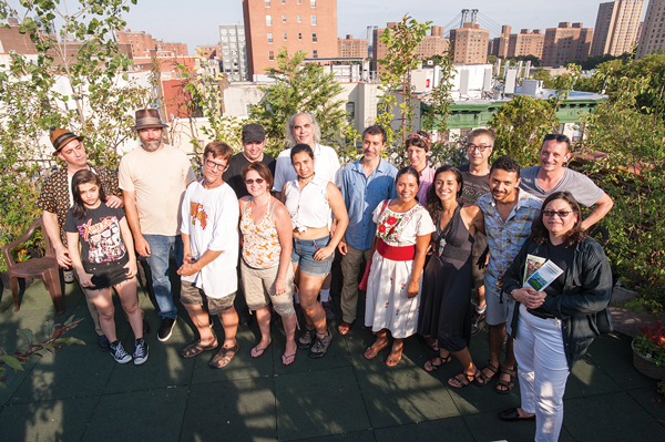 Some of Umbrella House’s 32 residents, with Councilmember Rosie Mendez, at far right.   Photo by Roberto Mercado