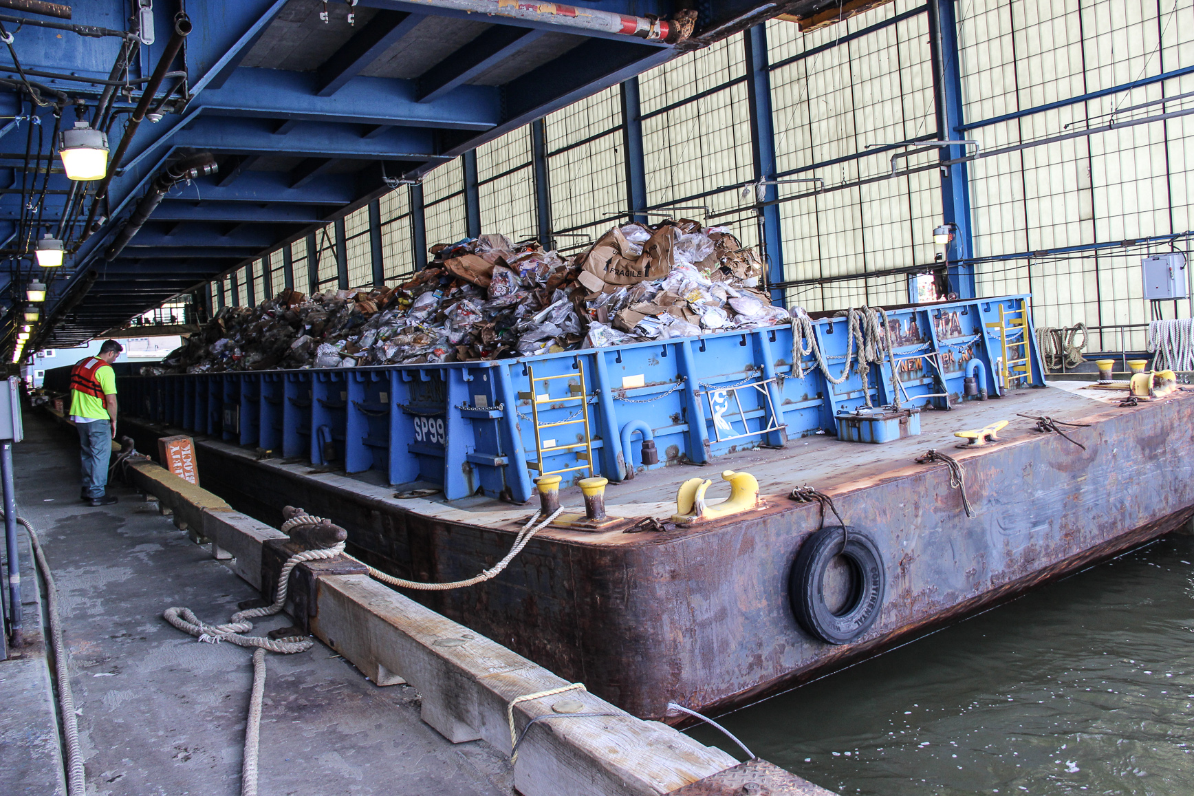 The barges are loaded in the slip until they have at least 360 tons of paper, then are sent for recycling.