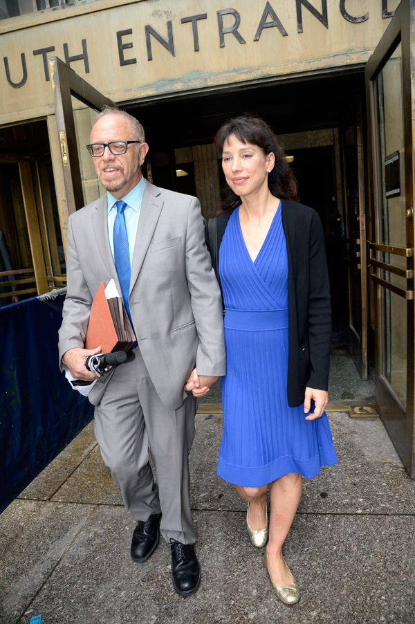 Arthur Schwartz and his wife, Kelly Craig, leaving criminal court on Tuesday after his arraignment. He had spent about four hours handcuffed behind his back.   Photo by Jefferson Siegel