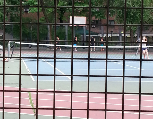 Although this photo was taken through the park fence, don’t get the impression that the Seward Park tennis courts — which are surrounded by a running track and hoops courts — aren’t welcoming. Just the opposite.   Photo by Gale Moorman