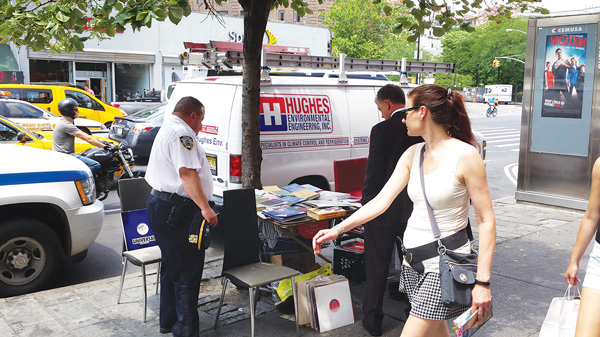 Captain Simonetti and Alberici checking out a vendor’s table, that violated regulations.