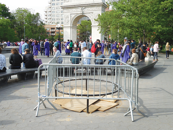 It’s time to redesign park’s pitiful tree pits 1 One of the three empty tree pits around the fountain plaza at Washington Square Park. Gates and plywood were put around the hole — making it even more unsightly — to keep parkgoers from tripping over the low railing and injuring themselves. Photos by Sharon Woolums
