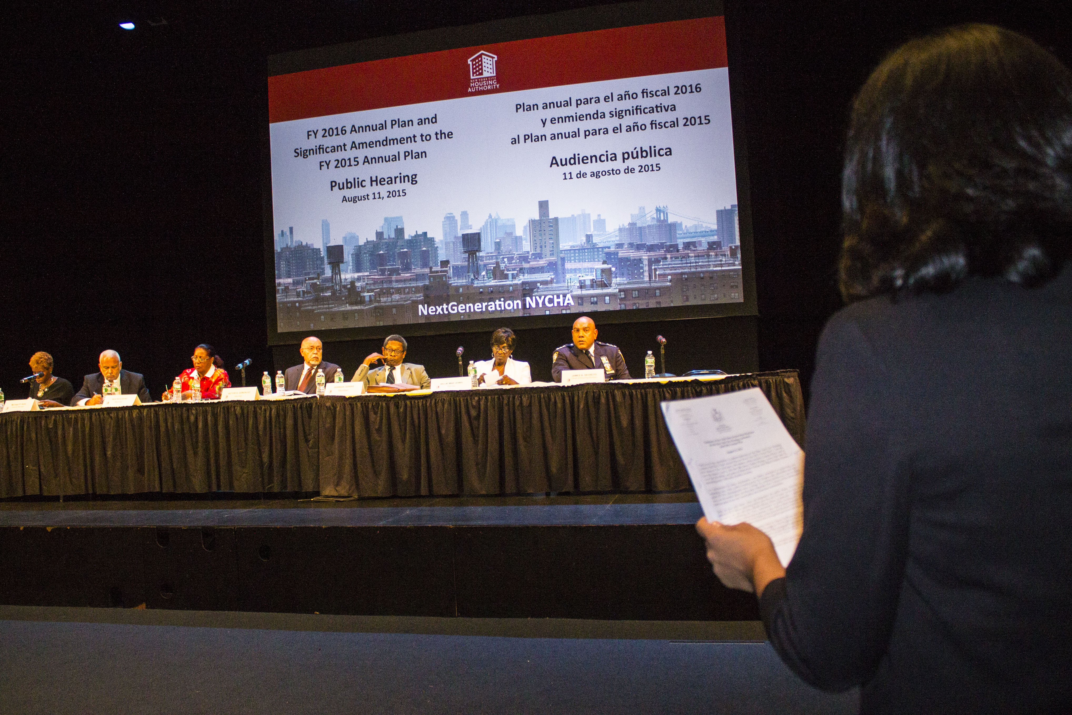 Possible NYCHA Privatization Riles Residents 2 A representative of State Sen. Brad Hoylman was one of numerous people to speak on Aug. 11, at a public hearing regarding NYCHA’s draft of its 2016 Annual Plan. Photo by Zach Williams.
