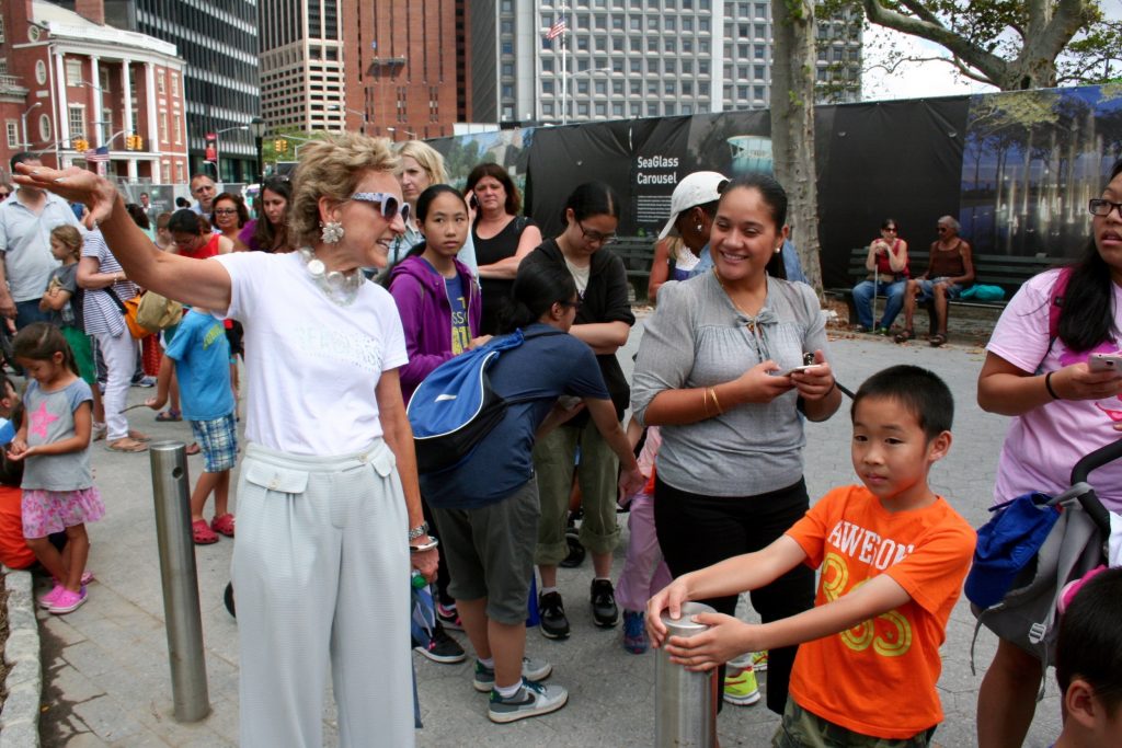 Warrie Price, founder and president of the Battery Conservatory, talking to visitors waiting in line.