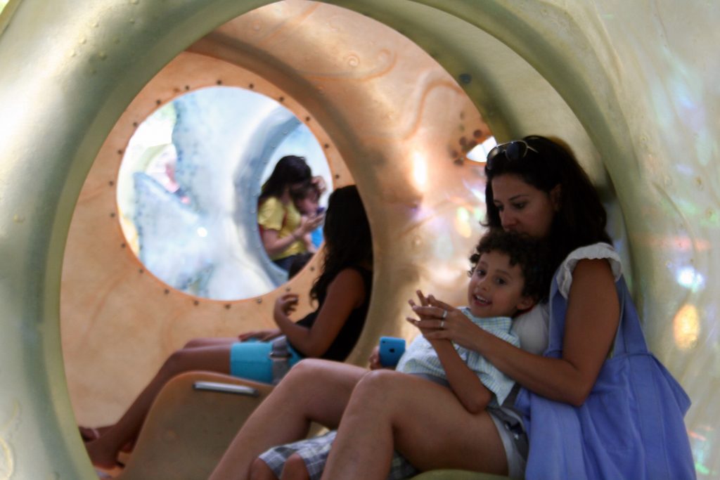 Sharon Arang with her four-year-old son, Ari, inside the carousel.