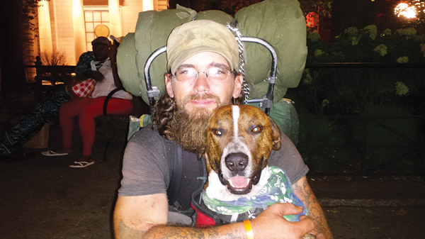 Clearwater, a veteran and former traveler, with his well-trained dog, Hitchhiker, in Union Square.   Photo by Lincoln Anderson