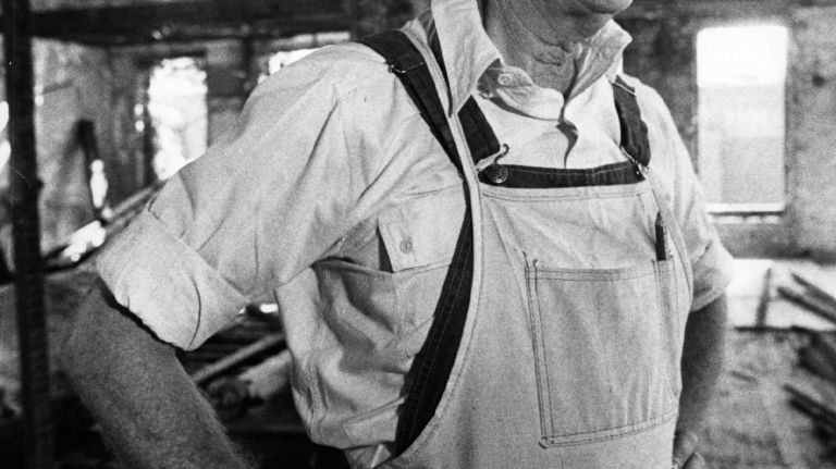 Former President Jimmy Carter pauses from his work helping to restore a rundown tenement on the Lower East Side on E. 6th St in New York City on Sept. 7, 1984. 