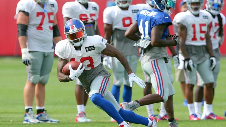 New York Giants wide receiver Odell Beckham Jr. runs with the ball during training camp at the Quest Diagnostics Training Center in East Rutherford, N.J., on Saturday, Aug. 8, 2015.