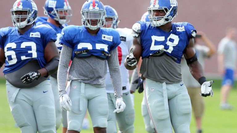 New York Giants defensive end Owamagbe Odighizuwa reacts after a play during training camp at the Quest Diagnostics Training Center in East Rutherford, N.J., on Saturday, Aug. 8, 2015.