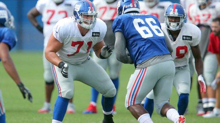 New York Giants tackle Sean Donnelly blocks defensive end Jordan Stanton during training camp at the Quest Diagnostics Training Center in East Rutherford, N.J., on Saturday, Aug. 8, 2015.