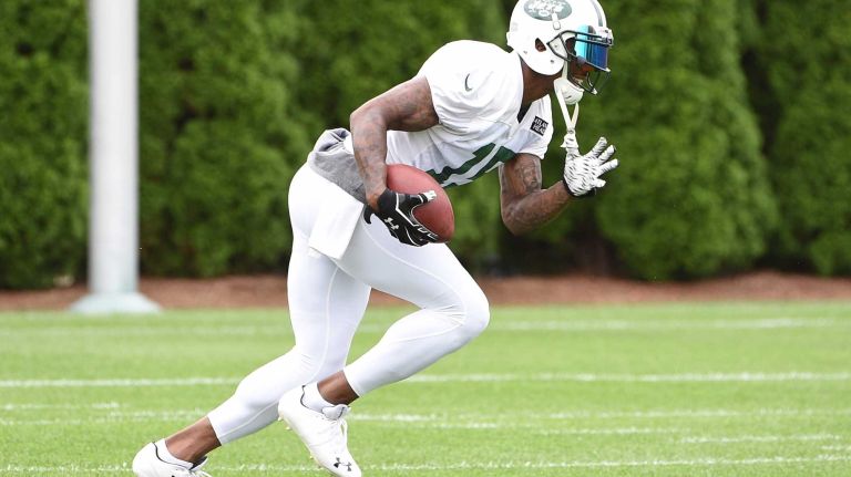 New York Jets wide receiver Brandon Marshall (15) makes a catch and runs with the football during practice at the Jets' Atlantic Health Training Center on Monday, August 10, 2015 in Florham Park, N.J.
