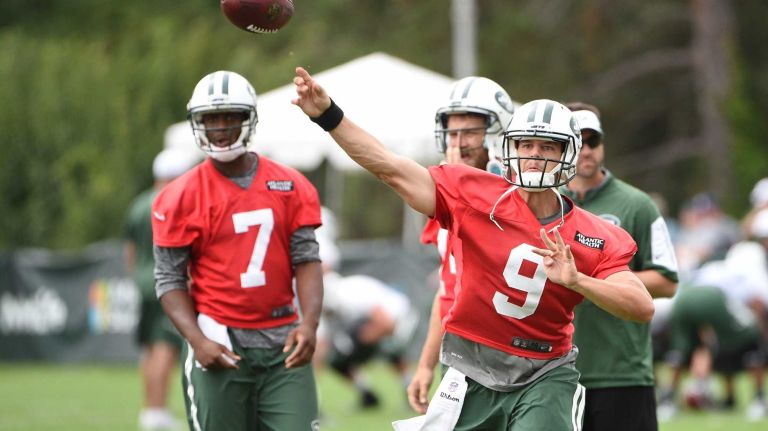 New York Jets quarterback Bryce Petty (9) passes the football as quarterback Geno Smith (7) observes at the Jets' Atlantic Health Training Center on Monday, August 10, 2015 in Florham Park, N.J.
