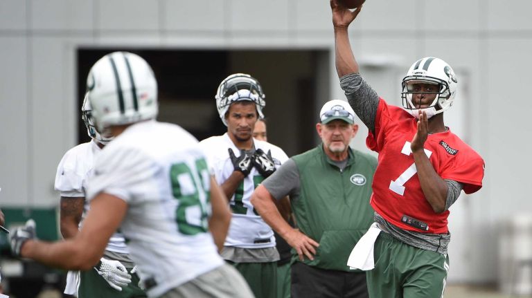 New York Jets quarterback Geno Smith (7) passes the football to New York Jets tight end Jace Amaro (88) at the Jets' Atlantic Health Training Center on Monday, August 10, 2015 in Florham Park, N.J.