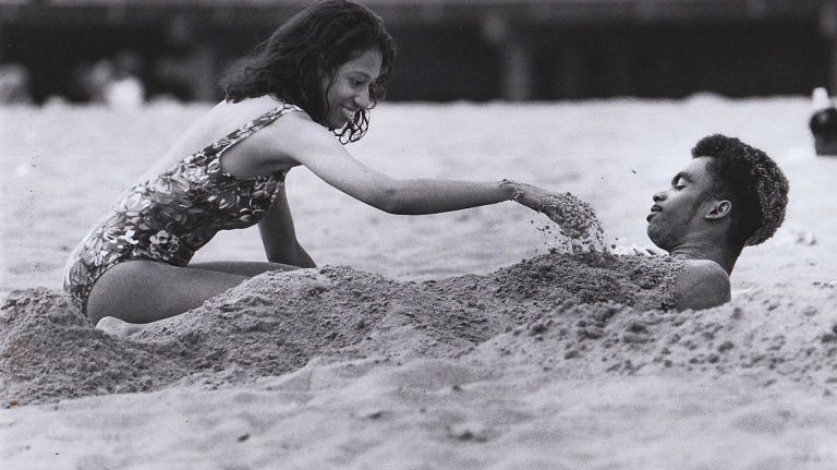Henry Dutes gets buried in the Coney Island sand by his friend Diana Simon. (June 16, 1994)