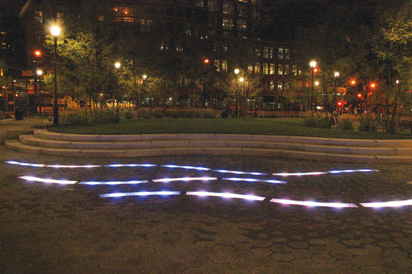 Hospital triangle goes ‘back to the land’ as new park opens; AIDS memorial is coming next 6 Squiggly lines of lights embedded in the paving illuminate the new Seventh Ave. green spot at night.