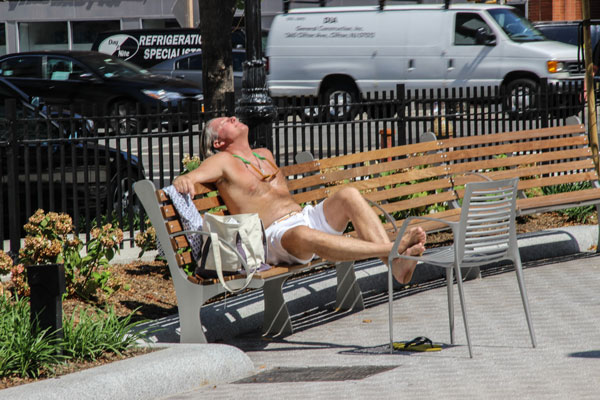 A sun worshiper went straight to one of the new curvy wooden benches to soak up some rays.
