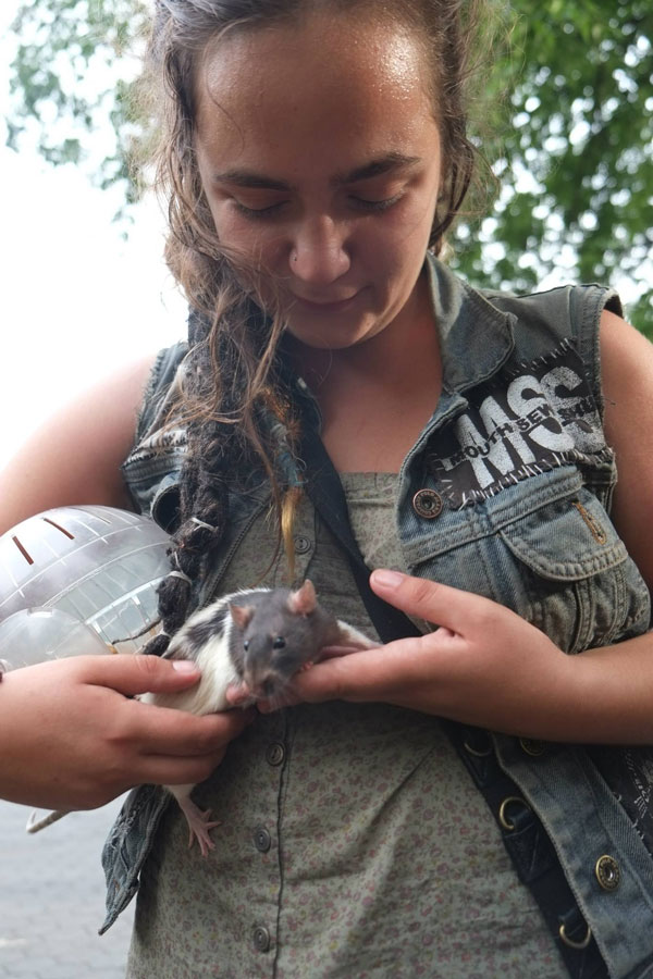 Crusties don’t just have dogs. A traveler with her pet rat in Tompkins Square Park at the Riot Anniversary concerts this past weekend. Photo by John Penley 