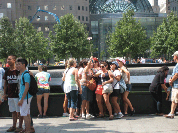 Smiles & selfies @ #9/11Memorial: Downtown Notebook 2 Downtown Express photo by Dusica Sue Malesevic Posing for selfies at the 9/11 Memorial.