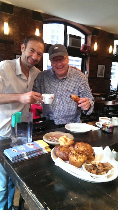 Acqua Restaurant managing partner Nicholas Berti, left, and Water St. neighbor David Richter enjoy a continental breakfast.