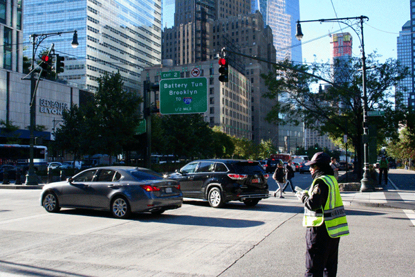 Downtown Express photo by Yannic Rack This P.S. 89 crossing guard covers West and Warren Sts. in the morning, but she has to abandon the post every afternoon to watch Chambers St.   