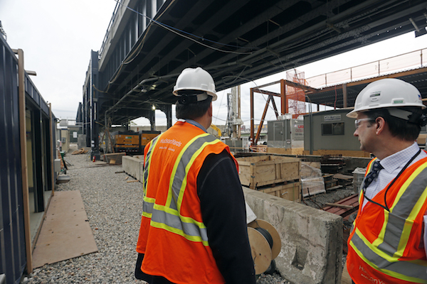 At Hudson Yards, Managing a Site While Sculpting a City 3 Geoff Butler, right, standing under a section of the High Line. The northernmost section of the park wraps around Hudson Yards and is partly incorporated into its design. Photo by Joe Woolhead.