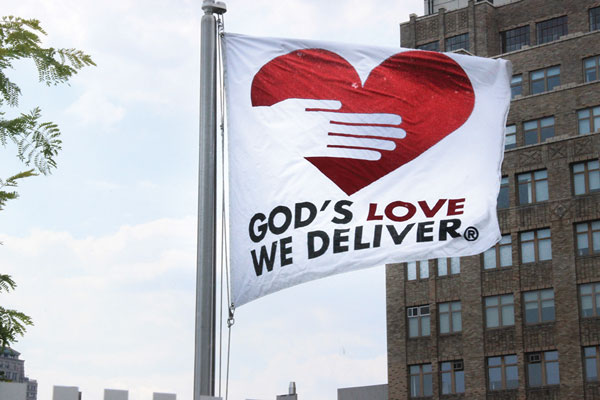 With its new, bigger building, God’s Love — which sports its own signature flag on the rooftop — hopes to achieve new heights.   Photos by Tequila Minsky