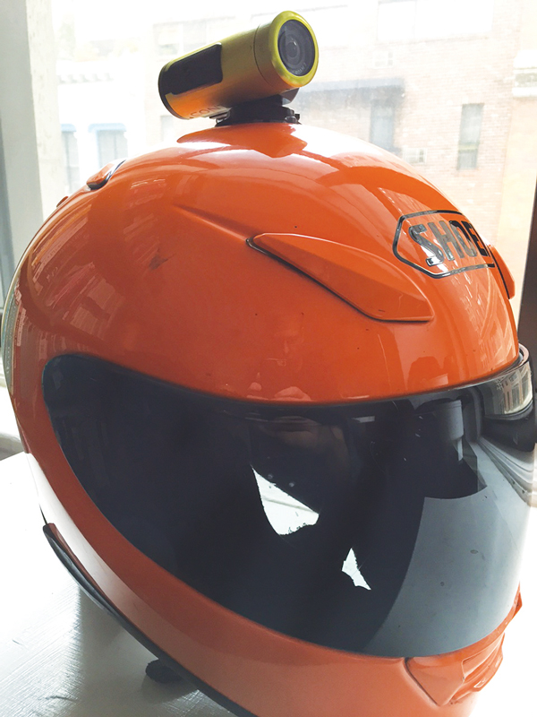 Jesse Erlbaum’s motorcycle helmet with a camera mounted on top of it. For the past two years, he’s been riding with the helmet cam to document drivers texting and watching monitors while on the road.