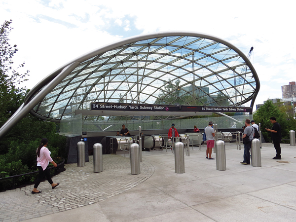 The stylish, glass-canopied entrance to the Hudson Yards No. 7 train station.   Photos by Vincent LaFaro