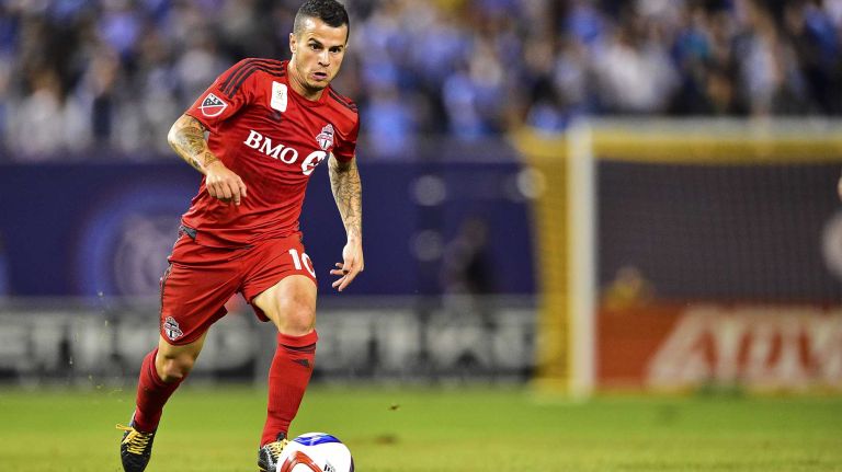 Toronto FC midfielder Sebastian Giovinco carries the ball upfield in an MLS game against New York City FC at Yankee Stadium on Wednesday, Sept. 16, 2015.