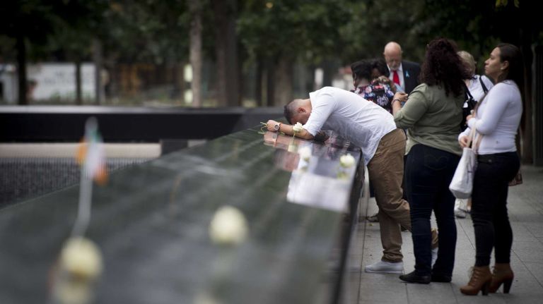 Hernan Gomez mourns his father Wilder Alfredo Gomez, a Windows of the World employee who died during the Sept. 11 terror attacks. Hernan Gomez gathered with others at Ground Zero on Sept. 11, 2015 to honor and remember those lost 14 years ago.