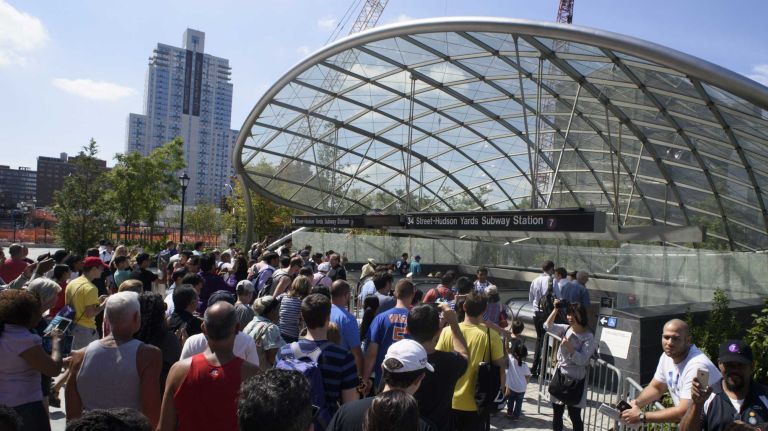 The first passengers enter the 34th Street-Hudson Yards No. 7 station in Manhattan as service begins on Sunday, Sept. 13, 2015. The 7 Line extension to 34th Street-11th Avenue is the only line south of 59th Street to provide service west of Ninth Avenue.