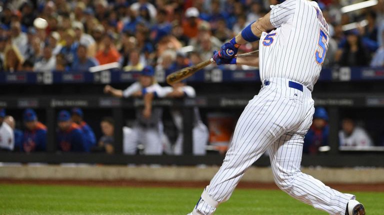 New York Mets third baseman David Wright doubles against the Miami Marlins during the first inning of a game at Citi Field on Monday, Sept. 14, 2015.