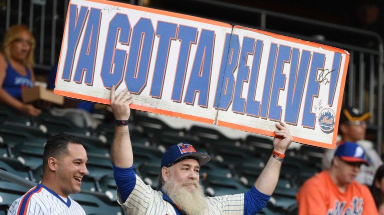 A fan holds up a sign before a game between the New York Mets and the Miami Marlins at Citi Field on Monday, Sept. 14, 2015.