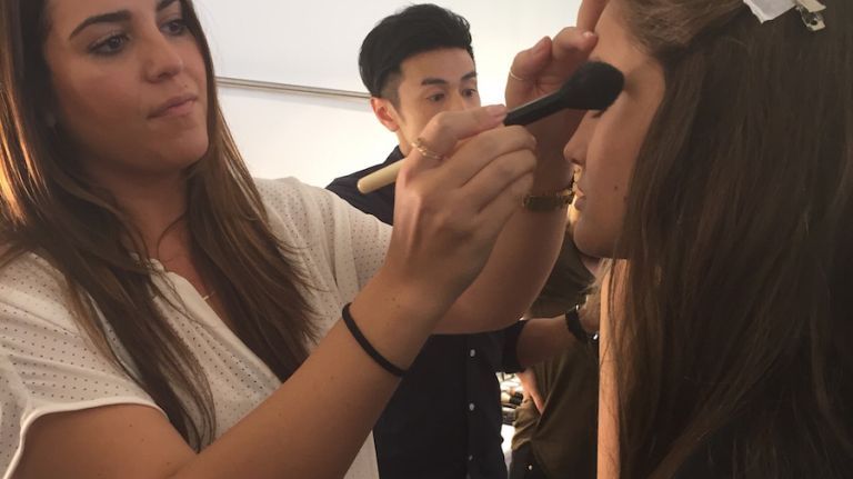 Models get ready backstage at the Elie Tahari Spring 2016 collection for New York Fashion Week on September 13, 2015.
