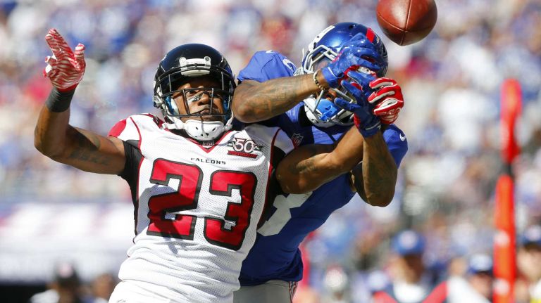 Robert Alford #23 of the Atlanta Falcons breaks up a pass intended for Odell Beckham #13 of the New York Giants during an NFL game at MetLife Stadium on Sunday, Sept. 20, 2015.