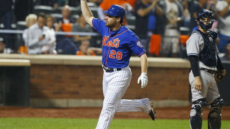 Subway Series: Yankees vs. Mets 80 Daniel Murphy of the New York Mets celebrates his sixth-inning home run as John Ryan Murphy of the New York Yankees looks on at Citi Field on Friday, Sept. 18, 2015.