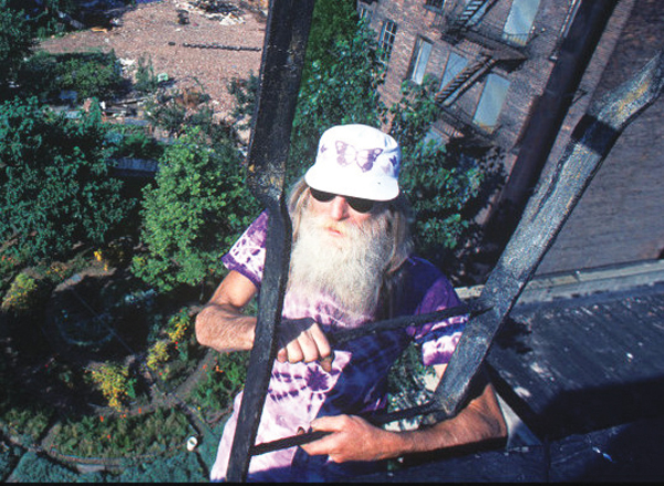 Photo copyright Harvey Wang Adam Purple atop his building’s fire escape above the Garden of Eden. 