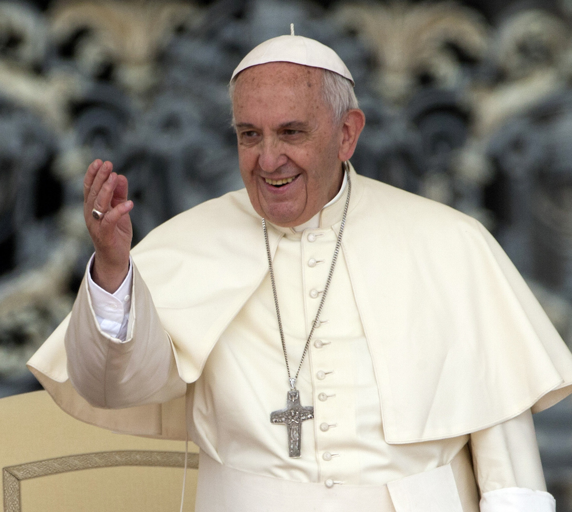 FILE - In this Wednesday, May 20, 2015, file photo, Pope Francis waves to faithful during his weekly general audience, in St. Peter's Square, at the Vatican. Pope Francis is joining a colorful cast of characters painted on the outside of buildings across Philadelphia. Officials announced Thursday, May 28, 2015, that hundreds of residents and visitors will help create a mural honoring the pontiff and families. Pope Francis is scheduled to visit Philadelphia in September. (AP Photo/Andrew Medichini, File)