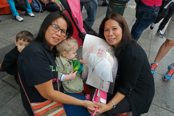 Some admirers of Pope Francis. Downtown Express photo by Milo Hess.