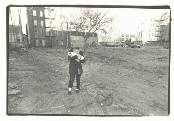 Adam Purple walking on the former site of his Garden of Eden after it was razed by the city for affordable housing in 1986. Brooklyn College Library Archives / Photo by Brian O’Donoghue