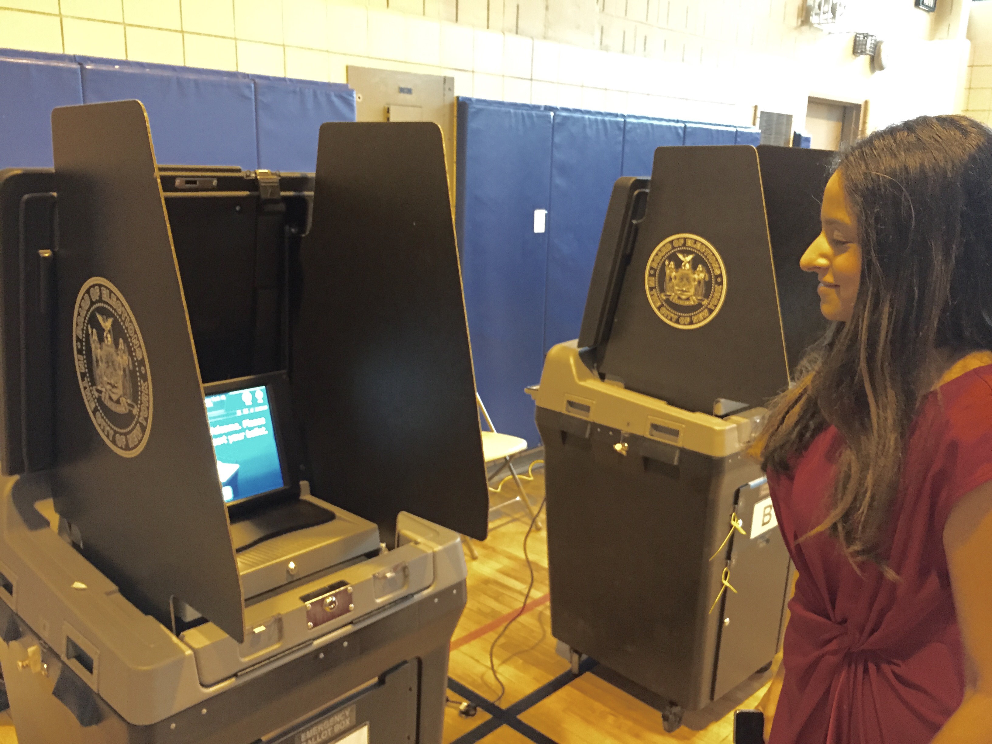 District Leader Jennifer Rajkumar, who represents the 65th A.D., Part C, and supported Cude and Gault, checking the poll site at P.S. 234.