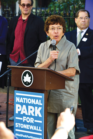 Stonewall participant Martha Shelley, with Tobi Bergman, behind her to the left, and Jerrold Nadler, right.  Photo by Donna Aceto