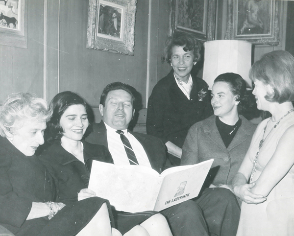 A committee — enjoying Saul Steinberg’s “The Labyrinth” — while planning a V.I.D. fundraiser at the Village Gate, with Theo Bikel, center, and Villagers, including Carol Greitzer, far left, and Mitch Rein, far right.   Photo courtesy Carol Greitzer