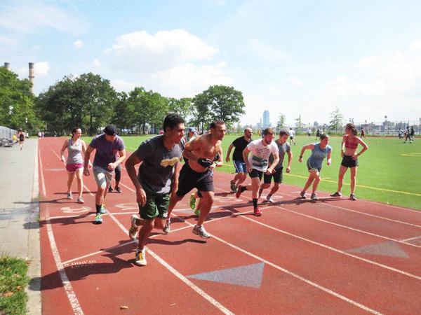 Take them to the river: CFER members push it on the running track in East River Park.