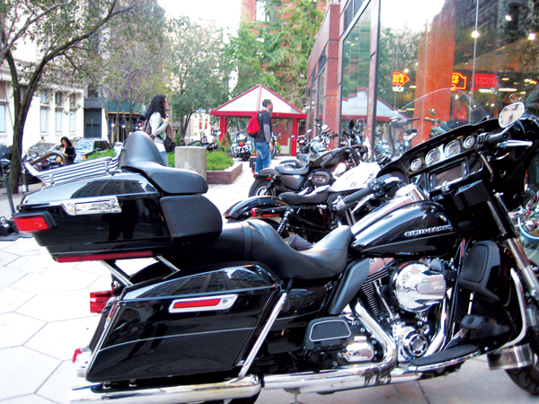 Downtown Express photos by Dusica Sue Melsevic Harley-Davidson motorcycles parked on the public plaza outside its Tribeca store. 