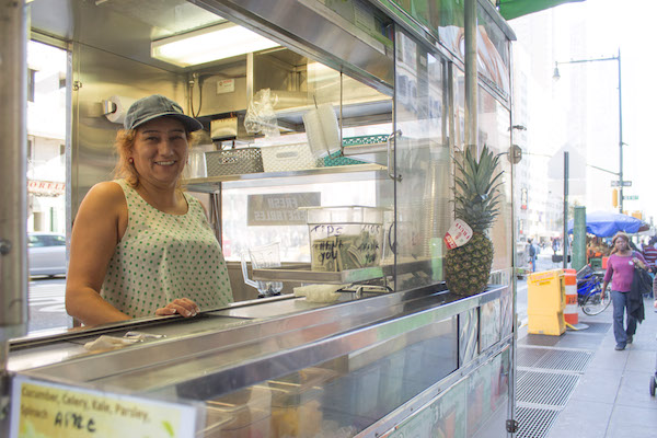 Vendors Push to Lift Permit Cap 2 Trancia Anabela Acosta sells smoothies on Eighth Ave. (btw. 50th & 51st Sts.) on Mon., Oct. 12. She would like to have her own business, but has waited for eight years for the necessary city street vending permit. Photo by Zach Williams.