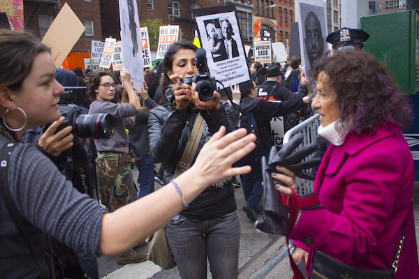 Protests Annoying? Murder Is Infuriating, Say #RiseUpOctober Participants 2 Chelsea resident Eileen Feldman (right) told protester Hannah Raytaylor (left) that protests against police brutality unfairly demonize law enforcement as a whole. Photo by Zach Williams.